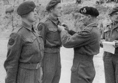 [Thumb - V55-LCpl Tickle of No.48 RM Commando and Marine Hardy of No.46 RM commando, being awarded MMs by General Bernard Montgomery for actions in Normandy..jpg]